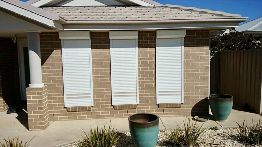 Roller shutters on a brick home