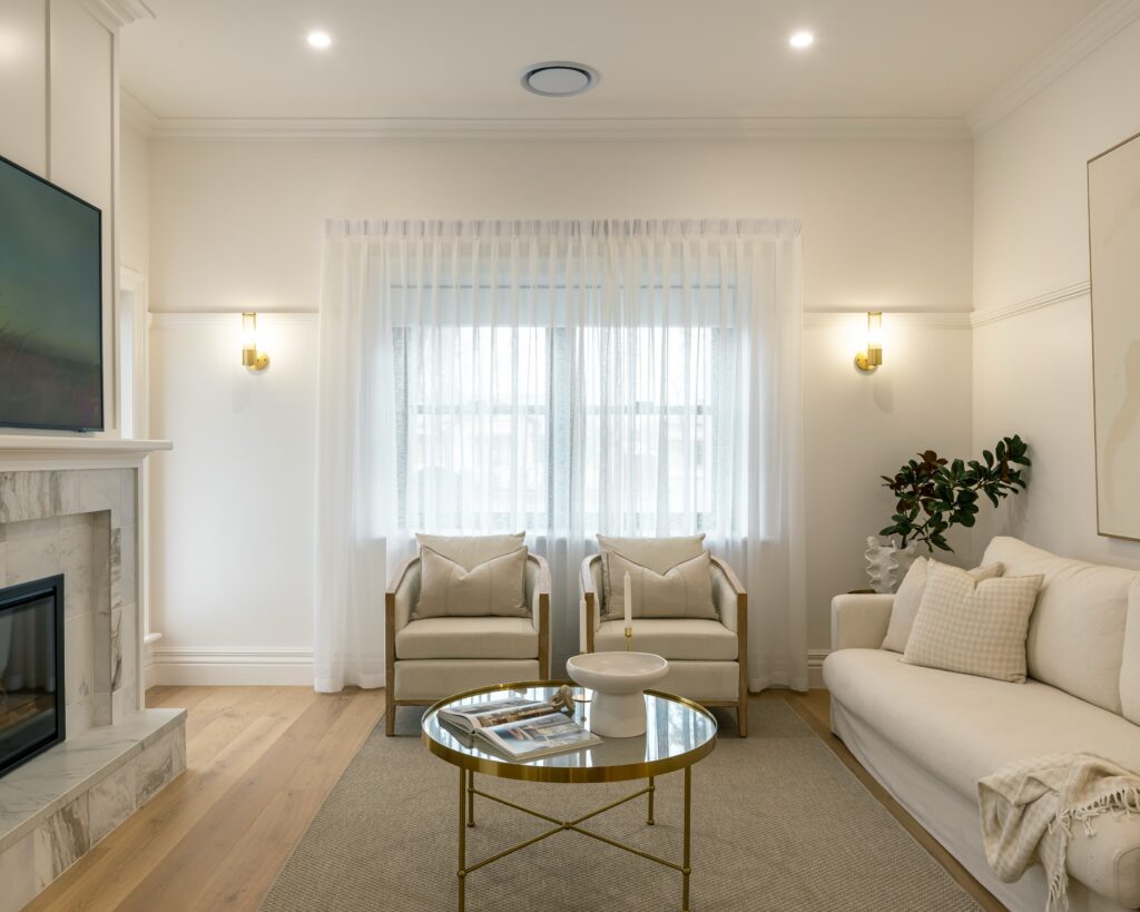Pinch pleat sheers and blockout rollers in a new Wagga home